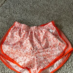 Nike womans running shorts orange/white size medium